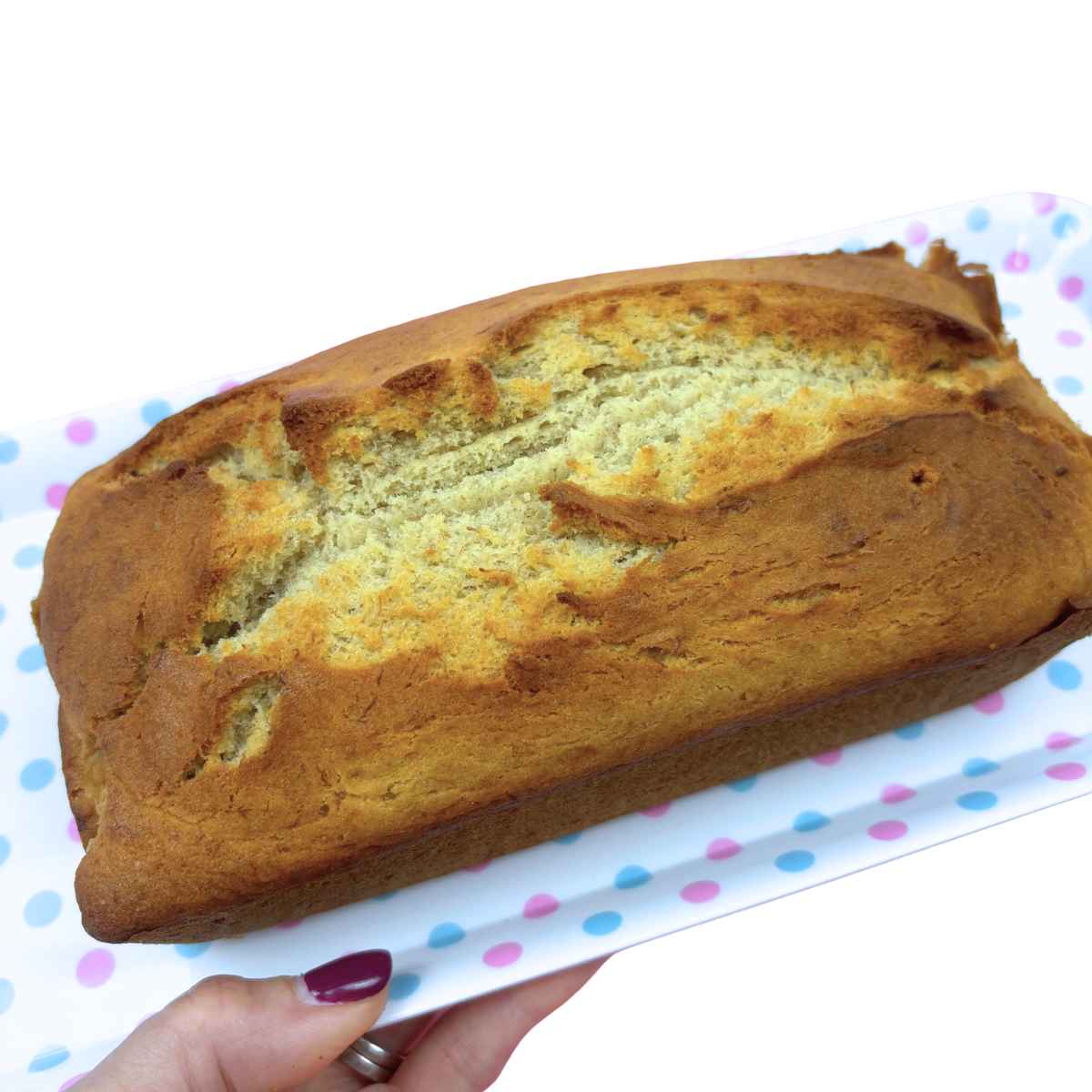 Easy gluten free banana bread, full loaf on a spotted tray